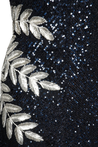 STRETCH SEQUIN V-NECK GOWN WITH EMBELLISHED LEAF DETAIL